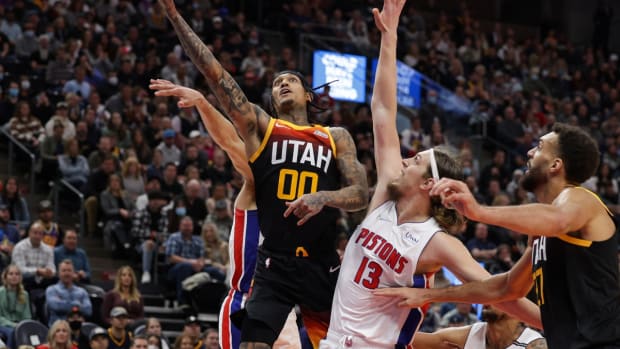 Jan 21, 2022; Salt Lake City, Utah, USA; Utah Jazz guard Jordan Clarkson (00) gets between Detroit Pistons guard Cade Cunningham (2) and forward Kelly Olynyk (13) and to the basket during the fourth quarter at Vivint Arena. Utah Jazz won 111-101. Mandatory Credit: Chris Nicoll-USA TODAY Sports